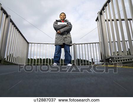 Stock Photo - child holding laptop. Fotosearch