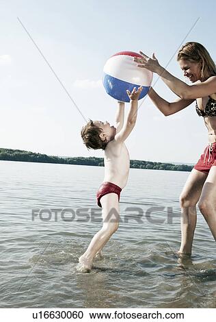 child jumping with mother View Large Photo Image Stock Image - child jumping with mother. Fotosearch
