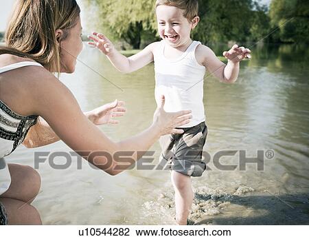 Child running to mother View Large Photo Image Stock Image - Child running to mother. Fotosearch