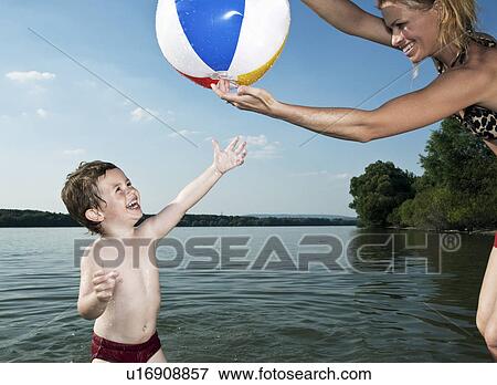 child trying to get ball View Large Photo Image Stock Photo - child trying to get ball. Fotosearch