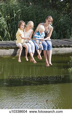 children fishing from footbridge View Large Photo Image Picture - children fishing from footbridge. Fotosearch