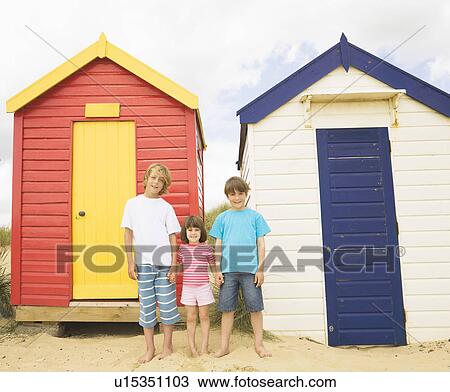 Children in front of beach huts View Large Photo Image Stock Image - Children in front of beach huts. Fotosearch