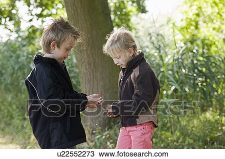 children playing in nature View Large Photo Image Stock Image - children playing in nature. Fotosearch