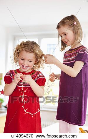 children playing with decoration lights View Large Photo Image Stock Image - children playing with decoration lights. Fotosearch