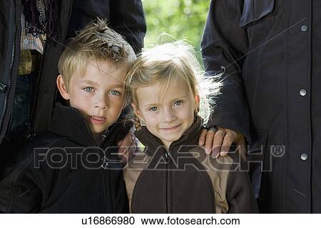 Stock Image - Children with parents. Fotosearch