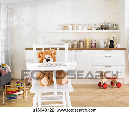 Stock Image - childrens toys in kitchen. Fotosearch