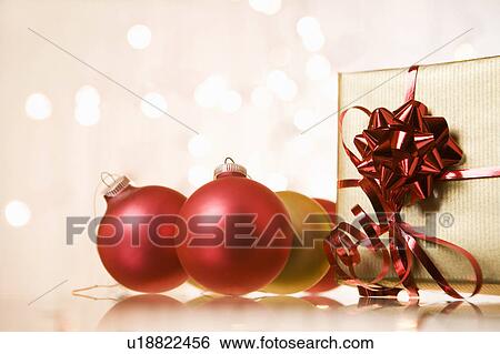 Christmas baubles and gift View Large Photo Image Stock Photograph - Christmas baubles and gift. Fotosearch