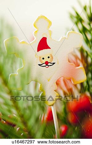 Stock Photo - christmas decoration amongst branches. Fotosearch