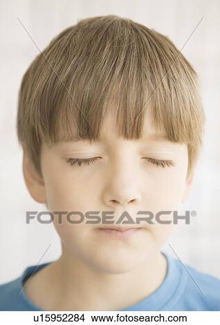 Picture - Close up portrait of young boys face. Fotosearch
