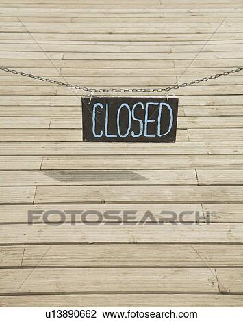 Stock Image - Closed sign over decking. Fotosearch