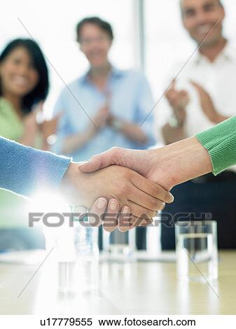 Closing a business deal by shaking hands View Large Photo Image Stock Photography - Closing a business deal by shaking hands. Fotosearch