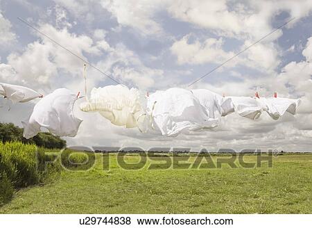 Clothing on a washing line View Large Photo Image Stock Photo - Clothing on a washing line. Fotosearch