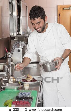 cook preparing plate View Large Photo Image Stock Image - cook preparing plate. Fotosearch