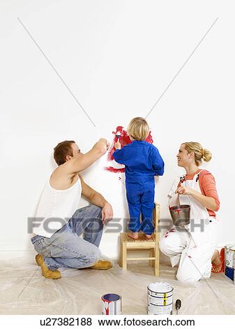 Couple and toddler boy painting wall View Large Photo Image Stock Photo - Couple and toddler boy painting wall. Fotosearch