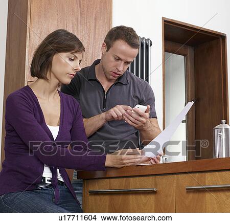 Couple calculating bills View Large Photo Image Picture - Couple calculating bills. Fotosearch