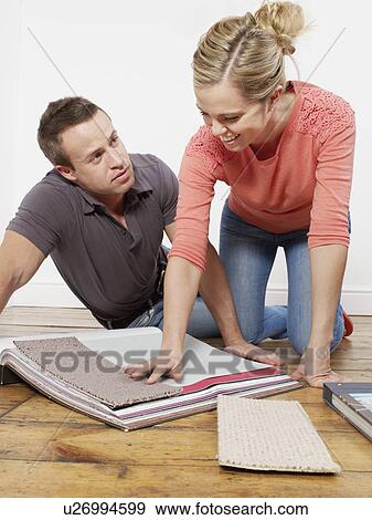 Couple choosing carpet samples View Large Photo Image Stock Photo - Couple choosing carpet samples. Fotosearch