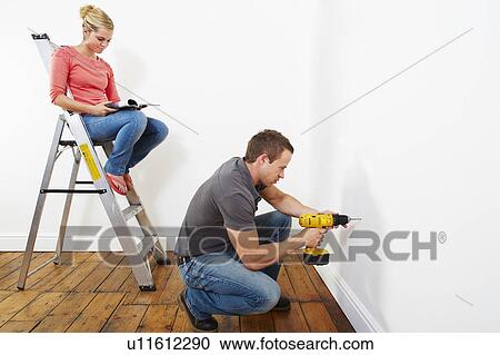 Couple doing DIY View Large Photo Image Stock Image - Couple doing DIY. Fotosearch