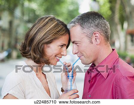 couple drinking out of same glass View Large Photo Image Stock Image - couple drinking out of same glass. Fotosearch