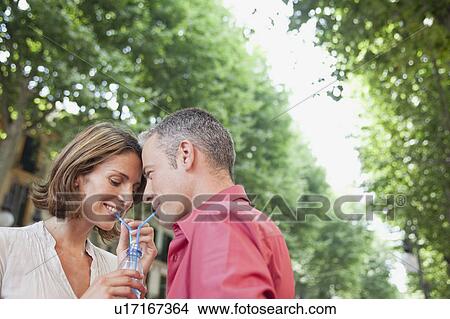 couple drinking out same glass View Large Photo Image Picture - couple drinking out same glass. Fotosearch