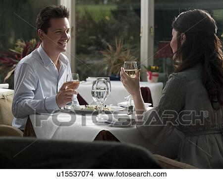 couple eating evening meal in restaurant View Large Photo Image Picture - couple eating evening meal in restaurant. Fotosearch