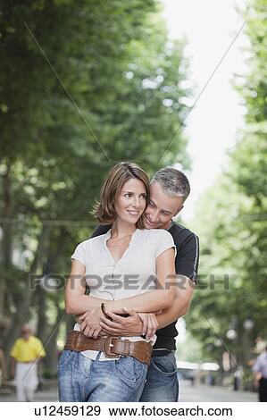 couple embracing each other View Large Photo Image Stock Photo - couple embracing each other. Fotosearch