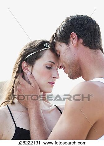 couple embracing on the beach View Large Photo Image Stock Image - couple embracing on the beach. Fotosearch
