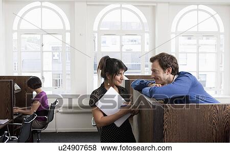 Couple flirting in Business center View Large Photo Image Stock Photo - Couple flirting in Business center. Fotosearch