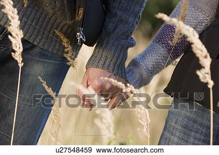 couple hand in hand View Large Photo Image Stock Photo - couple hand in hand. Fotosearch