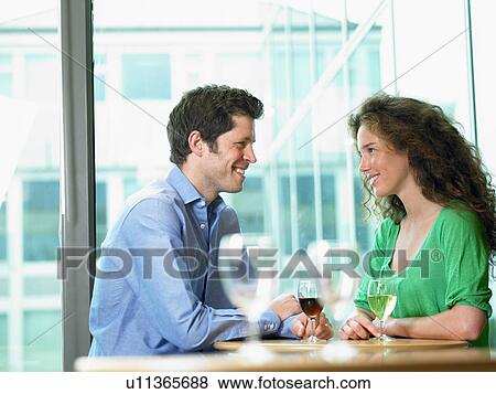 Stock Photo - Couple having drinks. Fotosearch