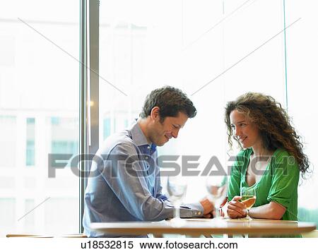 Stock Photography - Couple having drinks. Fotosearch