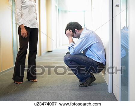 Couple having problems at work View Large Photo Image Stock Photo - Couple having problems at work. Fotosearch