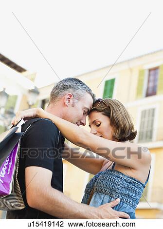 couple holding each other smiling View Large Photo Image Stock Image - couple holding each other smiling. Fotosearch