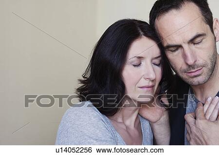 couple holding hands eyes closed View Large Photo Image Stock Photograph - couple holding hands eyes closed. Fotosearch