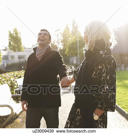 Stock Photo - couple holding hands. Fotosearch