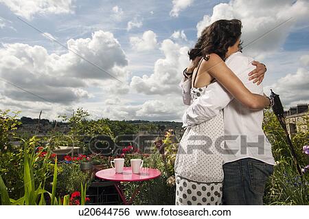 couple hugging on balcony View Large Photo Image Stock Photograph - couple hugging on balcony. Fotosearch