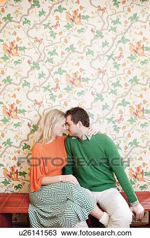 Stock Image - couple hugging on bench. Fotosearch