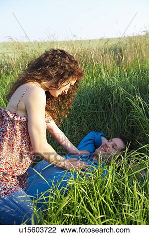 Stock Image - Couple in a wheat field. Fotosearch