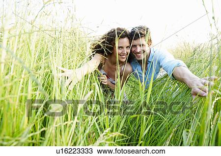 Couple in a wheat field View Large Photo Image Stock Image - Couple in a wheat field. Fotosearch