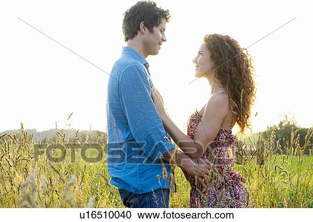 Couple in a wheat field View Large Photo Image Stock Image - Couple in a wheat field. Fotosearch