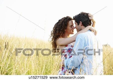 Couple in a wheat field View Large Photo Image Stock Photo - Couple in a wheat field. Fotosearch