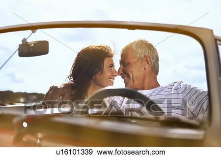 Couple in car, about to kiss View Large Photo Image Stock Photo - Couple in car, about to kiss. Fotosearch