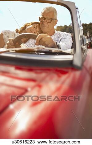Couple in car, her head on shoulder View Large Photo Image Stock Image - Couple in car, her head on shoulder. Fotosearch