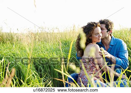 Couple kissing in a wheat field View Large Photo Image Stock Photography - Couple kissing in a wheat field. Fotosearch