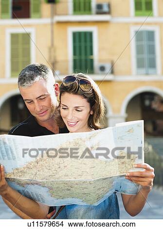 couple looking at a map View Large Photo Image Picture - couple looking at a map. Fotosearch