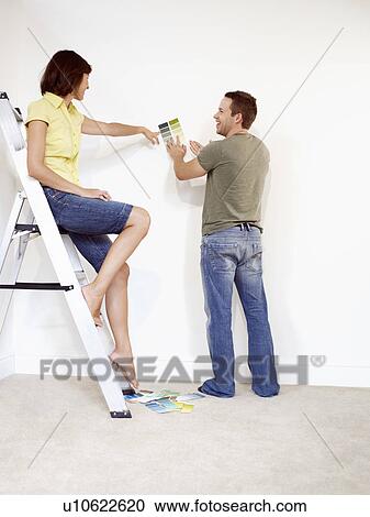 Couple looking at colour samples View Large Photo Image Stock Image - Couple looking at colour samples. Fotosearch