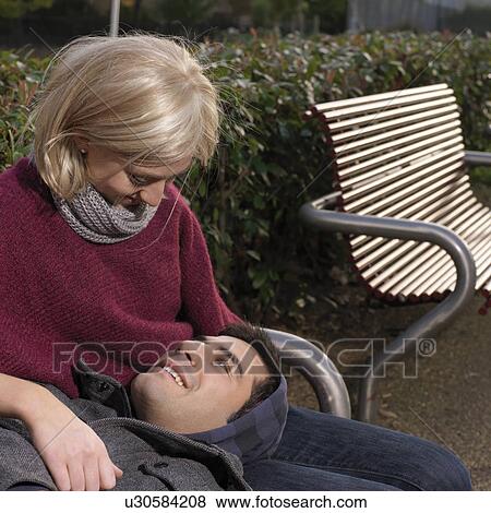Stock Photo - couple looking at each other. Fotosearch