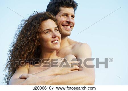 Stock Photo - Couple looking in the same direction. Fotosearch