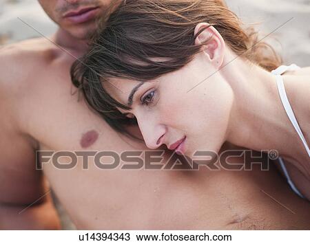 couple lying on the beach View Large Photo Image Stock Image - couple lying on the beach. Fotosearch