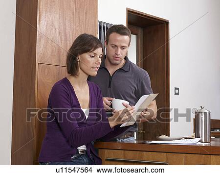 Couple opening letter View Large Photo Image Picture - Couple opening letter. Fotosearch