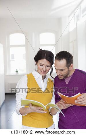 couple reading magazines View Large Photo Image Stock Image - couple reading magazines. Fotosearch
